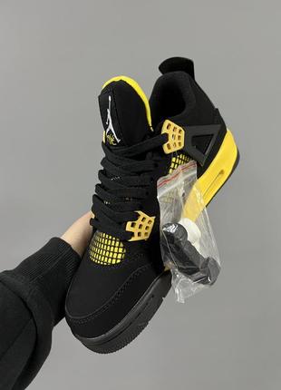 Шикарные мужские кроссовки nike air jordan 4 retro thunder чёрные с жёлтым4 фото