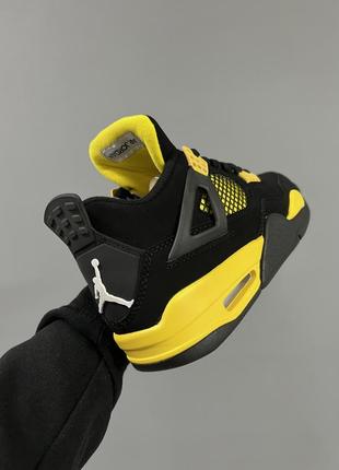 Шикарные мужские кроссовки nike air jordan 4 retro thunder чёрные с жёлтым5 фото