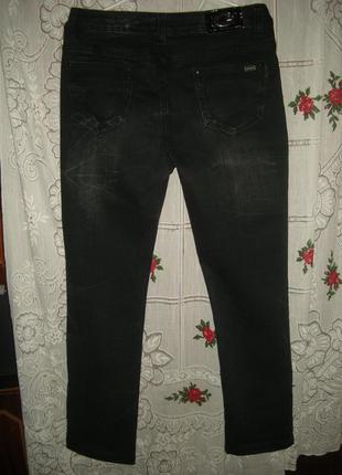 Супер джинсы"kaiweishi"р.31,черного цвета с потертостями2 фото
