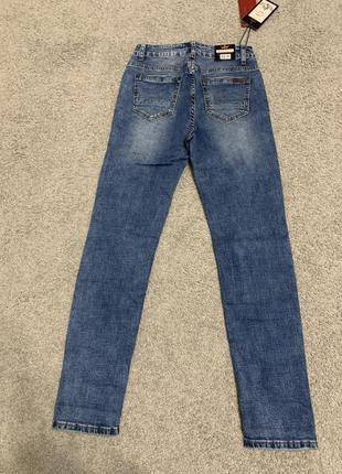 Женские джинсы американки зауженные с дирками avie 25-3010 фото