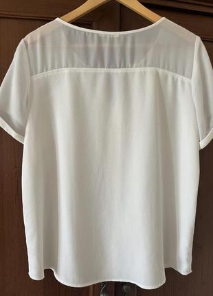 Блуза белого цвета с коротким рукавом4 фото