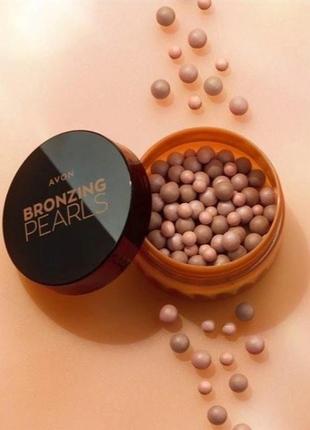 Бронзер у кульках avon bronzing pearls відтінок теплий(warm bronzer) 28 г1 фото