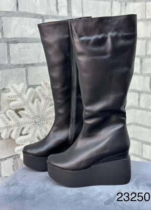 Високі зимові жіночі чоботи з натуральної шкіри на платформі7 фото