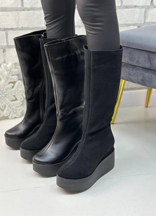 Високі зимові жіночі чоботи з натуральної шкіри на платформі9 фото