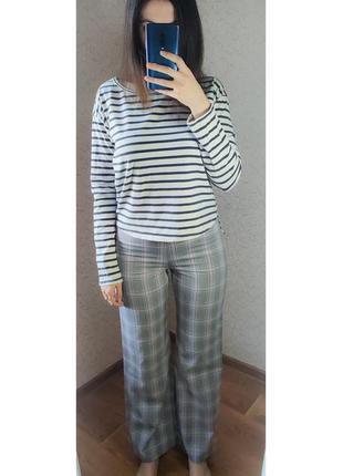 Стильные прямые брюки в клетку с высокой талией