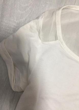 Нарядная белая футболка с блестящим карманом3 фото