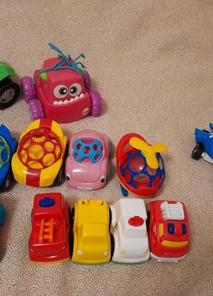 Машинка погремушка obal fisher price nuby