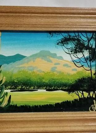 Картина маслом в дерев'яній рамці.