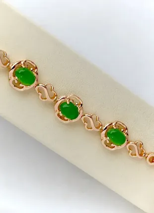 Позолоченный браслет с зелеными цирконами xuping m&amp;l длина 17-19 см. ширина 11 мм.(медицинское золото)