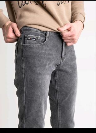 Чоловічі джинси на флісі 33-425 фото