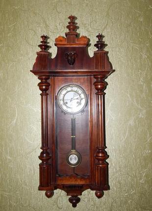 Старинные настенные часы с маятником1 фото