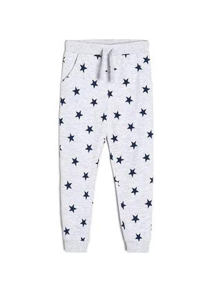 Якісні унісекс джогери sinsay на зріст 140 см спортивні штани з принтом зірки на манжетах сірі