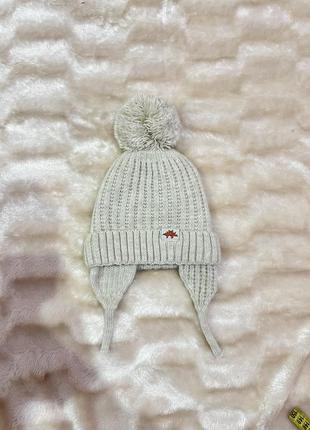 Бежевая теплая шапка на завязках / бежевая шапка зимняя1 фото