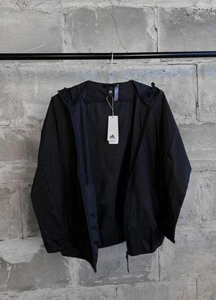 Куртка вітровка жіноча / чоловіча чорна з капюшоном легка adidas ia81358 фото