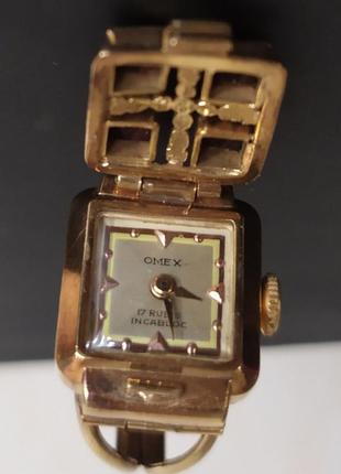 Omex швейцария золотые часы-каблочки6 фото