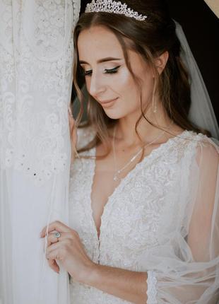 Весільна сукня з красивим декольте, кольору айворі.5 фото