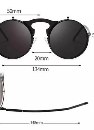 Круглі сонцезахисні окуляри з чорними відкидними лінзами.5 фото