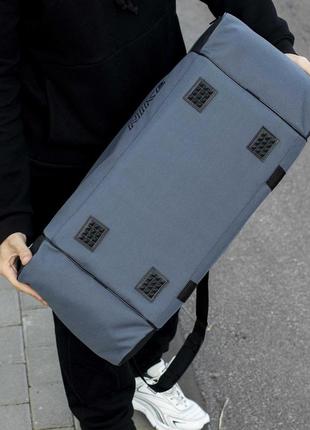 Большая дорожная спортивная сумка nike для тренировок и поездок на 55 литров серого цвета5 фото