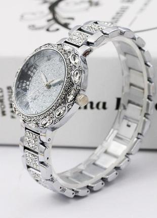 Жіночий наручний годинник із камінням8 фото
