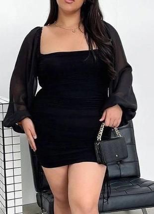 Жіноча чорна міні сукня, приталена модель з об’ємними  рукавами, модель яка фігуру7 фото