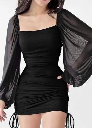 Жіноча чорна міні сукня, приталена модель з об’ємними  рукавами, модель яка фігуру3 фото