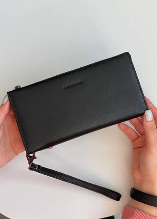 Чорний шкіряний жіночий гаманець клатч горизонтальний з хлястиком італійського бренду luigisanto.
