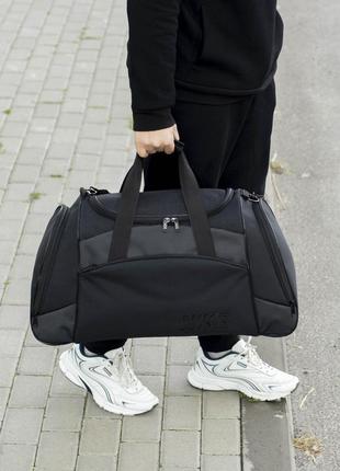 Большая дорожная спортивная сумка nike anta для тренировок и поездок на 55 литров черного цвета10 фото