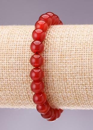 Браслет натуральный камень сердолик гладкий шарик d-8мм l-18см на резинке