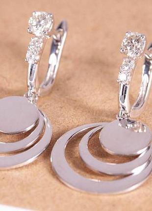 Женские сережки из белого золота с монетками