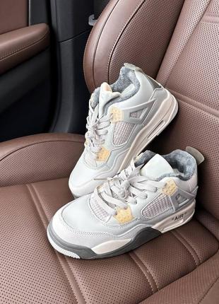 Зимові жіночі кросівки nike air jordan 4 winter photon dust fur сірого кольору з хутром