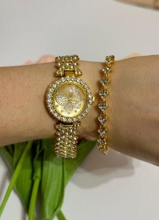 Розкішний годинник жіночий наручний кварцовий цвіт золотистий у каменях декор метелик у комплекті з сяйним9 фото