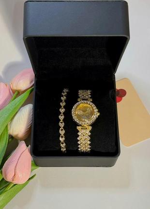Розкішний годинник жіночий наручний кварцовий цвіт золотистий у каменях декор метелик у комплекті з сяйним7 фото