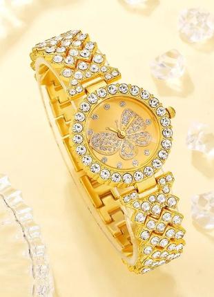 Розкішний годинник жіночий наручний кварцовий цвіт золотистий у каменях декор метелик у комплекті з сяйним3 фото