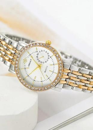 Стильний годинник жіночий наручний кварцовий колір сріблястий із золотистими домішками в подарунковій скриньці3 фото