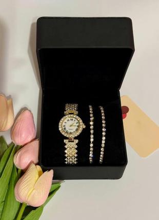 Годинник жіночий наручний кварцовий цвіт золотистий у камінні з браслетами 2 шт. у подарунковій скриньці2 фото