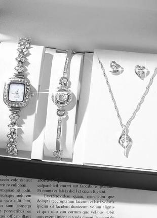 Сияющие часы женские наручные кварцевые цвет серебристый в камнях в комплекте с сияющим браслетом серьгами4 фото