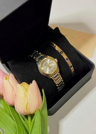 Годинник жіночий наручний кварцовий колір сріблястий із золотистими домішками в комплекті регульований