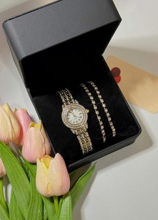 Часы женские наручные кварцевые цвет золотистый  в комплекте с браслетами 2 шт декор сверкающие камни в3 фото