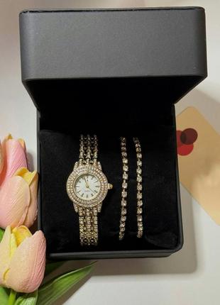 Часы женские наручные кварцевые цвет золотистый  в комплекте с браслетами 2 шт декор сверкающие камни в1 фото