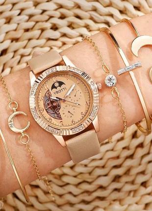 Комплект жіночих кварцових наручних годинників і браслетів.3 фото
