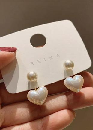 Милі елегантні жіночі сережки з перлами у формі серця3 фото