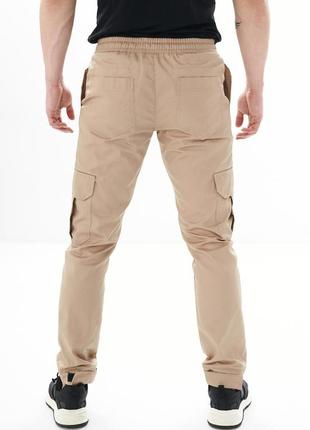 Чоловічі спортивні штани карго весняні осінні бежеві демісезонні штани з кишенями (b)3 фото