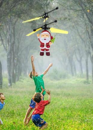 Іграшка літальний санта flying santa, що летить дід мороз