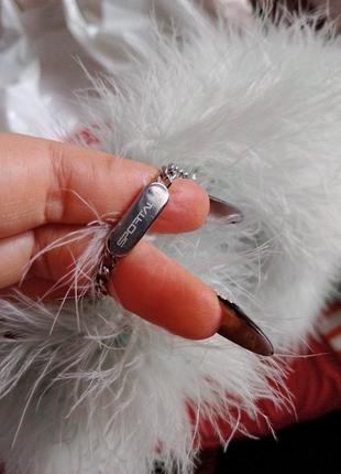 Шикарний жилетз лебяжого пуху