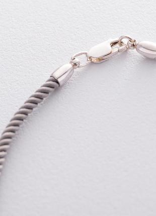 Шелковый серый шнурок с серебряной застежкой 
185204 фото
