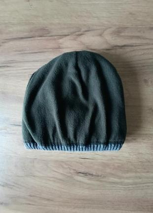 Вязаная очень теплая зимняя шапочка 
с отворотом на микрофлисе
цвет серый
,
размер универсальный
,может быть на подростка2 фото