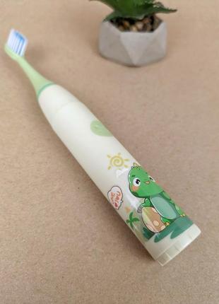 Дитяча електрична зубна щітка зелена динозавр7 фото