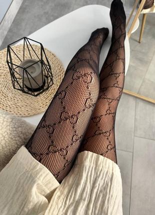 Мегакрути стильные трендовые колготки в сетку с принтом gg