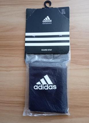 Тримачі щитків adidas guard stays1 фото