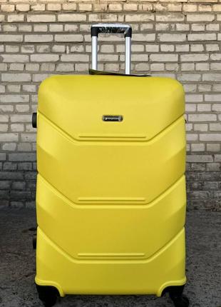 Велика міцна дорожня валіза на 4 колесах пластикова чорна розмір l madisson валіза чотириколісна чемодан на колесах8 фото